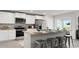 Well-lit kitchen featuring stainless steel appliances, a large island, and barstool seating at 8054 Bear Claw Ct., Conway, SC 29526