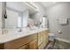 Bright bathroom with double sink vanity, white cabinets, and framed mirror at 825 Payne Ct., Conway, SC 29526