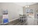 Bright dining room featuring a slider to a patio and wood-look floors at 825 Payne Ct., Conway, SC 29526