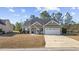 Charming single-story home with a well-manicured front yard and a two-car garage at 825 Payne Ct., Conway, SC 29526