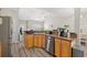 Modern kitchen featuring stainless steel appliances, ample countertop space, and an open layout, perfect for cooking and entertaining at 825 Payne Ct., Conway, SC 29526