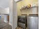 Laundry room featuring modern appliances, a door to the hallway and wire shelving at 825 Payne Ct., Conway, SC 29526