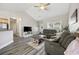 Bright and airy living room with vaulted ceilings and modern gray vinyl floors at 825 Payne Ct., Conway, SC 29526