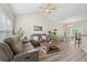 Bright living room with vaulted ceilings, hardwood floors, and comfortable seating, creating a welcoming atmosphere at 825 Payne Ct., Conway, SC 29526