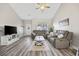 Bright and airy living room with vaulted ceilings and modern gray vinyl floors at 825 Payne Ct., Conway, SC 29526