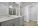 Bright bathroom featuring dual vanity, tile floor, and glass-enclosed shower at 8500 Dunes Point Way, Longs, SC 29568