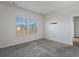 Bedroom with plush carpet, neutral walls, and large window at 8500 Dunes Point Way, Longs, SC 29568