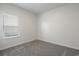 Bedroom with carpet flooring and a window at 8500 Dunes Point Way, Longs, SC 29568