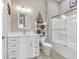 Bright bathroom with white cabinets, vanity, and shower/tub combo at 949 Crystal Water Way, Myrtle Beach, SC 29579