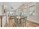 Bright dining room with wood floors and modern lighting, perfect for Gathering gatherings at 949 Crystal Water Way, Myrtle Beach, SC 29579