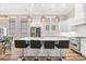 Modern kitchen with a large island, quartz countertops, and stainless steel appliances at 949 Crystal Water Way, Myrtle Beach, SC 29579