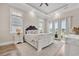 Main bedroom features wood floors, neutral paint, and a private balcony overlooking the property at 949 Crystal Water Way, Myrtle Beach, SC 29579