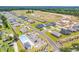 Aerial view of a neighborhood with a pool, parking area, and a clear view of home and community at 969 Oak Hollow St., Longs, SC 29568