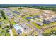 Aerial view of a new housing development with a pool, ponds, and landscaping at 969 Oak Hollow St., Longs, SC 29568