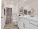 Pristine bathroom with a white vanity, quartz countertops, and modern fixtures at 969 Oak Hollow St., Longs, SC 29568