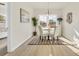 Cozy dining area features neutral decor, natural light, and views of the neighborhood at 969 Oak Hollow St., Longs, SC 29568