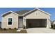 Charming single-story home with attached two-car garage and well-manicured lawn at 969 Oak Hollow St., Longs, SC 29568