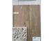 Close-up of beautiful new flooring and granite countertop samples for the home at 969 Oak Hollow St., Longs, SC 29568