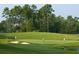 Scenic view of a lush green golf course, complete with sand traps and water features at 969 Oak Hollow St., Longs, SC 29568