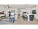 Open living room flows into kitchen with breakfast bar; bright, neutral decor at 969 Oak Hollow St., Longs, SC 29568