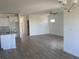 Open-concept living room with new vinyl flooring and views into the kitchen at 969 Oak Hollow St., Longs, SC 29568