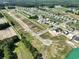 Aerial view of a new home community with ponds, green spaces, and houses at 990 Oak Hollow St., Longs, SC 29568