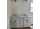 Bathroom featuring dual sinks, a white vanity, and modern fixtures at 990 Oak Hollow St., Longs, SC 29568