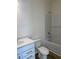 Bathroom with a bathtub, white tiled walls, and a vanity with white countertop at 990 Oak Hollow St., Longs, SC 29568