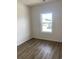 A bedroom with wood floors and a window providing ample natural light at 990 Oak Hollow St., Longs, SC 29568