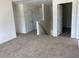 Upstairs hallway with neutral carpet, doors, and natural lighting at 990 Oak Hollow St., Longs, SC 29568