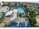 Aerial view of a community showcasing multiple pools, lounge areas, and lush greenery at 100 North Beach Blvd. # 1917, North Myrtle Beach, SC 29582