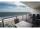 Spacious balcony featuring outdoor seating and stunning ocean views in the background at 100 North Beach Blvd. # 1917, North Myrtle Beach, SC 29582