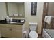 Bathroom featuring a granite vanity and a bathtub-shower combination enclosed with glass at 100 North Beach Blvd. # 1917, North Myrtle Beach, SC 29582