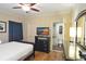 Cozy bedroom with a ceiling fan, TV, dresser and bathroom access at 100 North Beach Blvd. # 1917, North Myrtle Beach, SC 29582