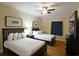 Bedroom featuring two beds, neutral walls, a ceiling fan, and a flat-screen TV for relaxation at 100 North Beach Blvd. # 1917, North Myrtle Beach, SC 29582