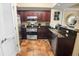 Well-equipped kitchen featuring stainless steel appliances, granite countertops, and dark wood cabinetry at 100 North Beach Blvd. # 1917, North Myrtle Beach, SC 29582