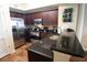 Well-equipped kitchen featuring stainless steel appliances, granite countertops, and dark wood cabinetry at 100 North Beach Blvd. # 1917, North Myrtle Beach, SC 29582