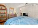 Bedroom with bed, wooden dresser, and TV, door to kitchen at 1000 N Waccamaw Dr. # 205, Murrells Inlet, SC 29576