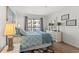 Comfortable bedroom featuring a plush bed, natural light, and a serene atmosphere at 1000 N Waccamaw Dr. # 205, Murrells Inlet, SC 29576