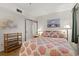 Bedroom with light walls, and a queen bed with coral accents at 1000 N Waccamaw Dr. # 205, Murrells Inlet, SC 29576