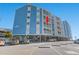 Angle view of a charming multifamily condo, showcasing the private balconies and a designated unit with beautiful curb appeal at 1000 N Waccamaw Dr. # 205, Murrells Inlet, SC 29576