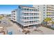 Beachside condo building with large balconies, elevated construction, and stunning ocean views at 1000 N Waccamaw Dr. # 205, Murrells Inlet, SC 29576