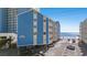 Beachfront condo exterior with parking at 1000 N Waccamaw Dr. # 205, Murrells Inlet, SC 29576