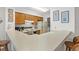 View of kitchen with white countertops, wood cabinetry, and stainless steel sink at 1000 N Waccamaw Dr. # 205, Murrells Inlet, SC 29576