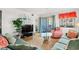 Cozy living room featuring a plush sofa, stylish decor, and a balcony with scenic outdoor views at 1000 N Waccamaw Dr. # 205, Murrells Inlet, SC 29576