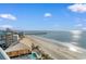 Amazing beach view with pier, pools, and orange condo building at 107 S Ocean Blvd. # 1002, Myrtle Beach, SC 29577