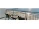 This private balcony is complete with chairs and a table to enjoy the ocean views at 107 S Ocean Blvd. # 1002, Myrtle Beach, SC 29577