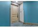 Hallway with ocean-themed wall paint and a light-colored door at 107 S Ocean Blvd. # 1002, Myrtle Beach, SC 29577