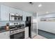 Modern kitchen featuring stainless steel appliances and granite countertops at 107 S Ocean Blvd. # 1002, Myrtle Beach, SC 29577