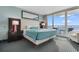 Comfortable main bedroom featuring balcony access with ocean views at 107 S Ocean Blvd. # 1002, Myrtle Beach, SC 29577